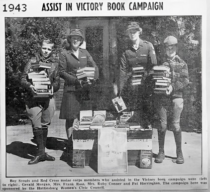 1943- Boy Scouts and Red Cross members collect books for distribution to service men
